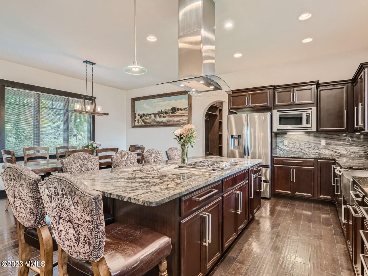 67 Robins Egg Eagle, CO 81631 - Photo 12 of 38 a large kitchen with stainless steel appliances granite countertop a sink stove and refrigerator