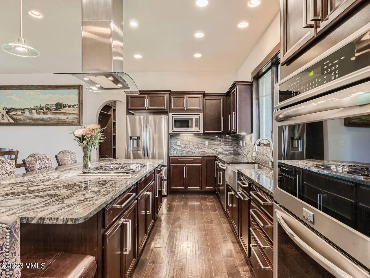67 Robins Egg Eagle, CO 81631 - Photo 13 of 38 a kitchen with stainless steel appliances sink stove refrigerator and cabinets