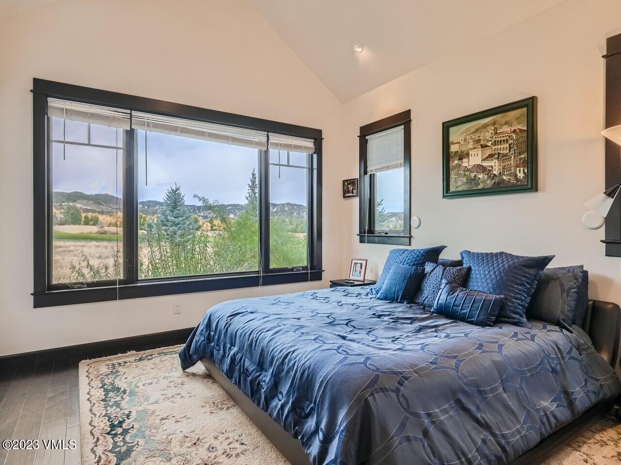 67 Robins Egg Eagle, CO 81631 - Photo 15 of 38 a large bed sitting in a bedroom next to a window