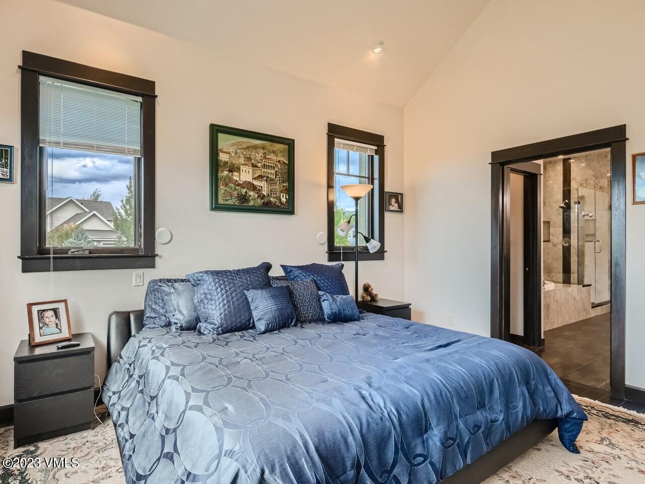 67 Robins Egg Eagle, CO 81631 - Photo 16 of 38 a bedroom with a large bed and a window