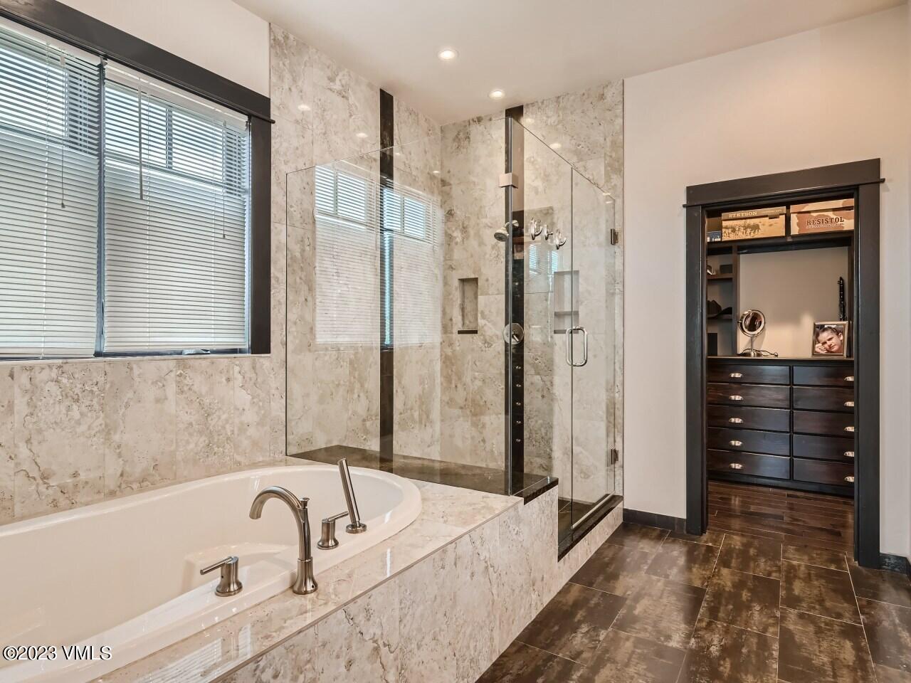 67 Robins Egg Eagle, CO 81631 - Photo 18 of 38 a bathroom with a tub a sink and a shower