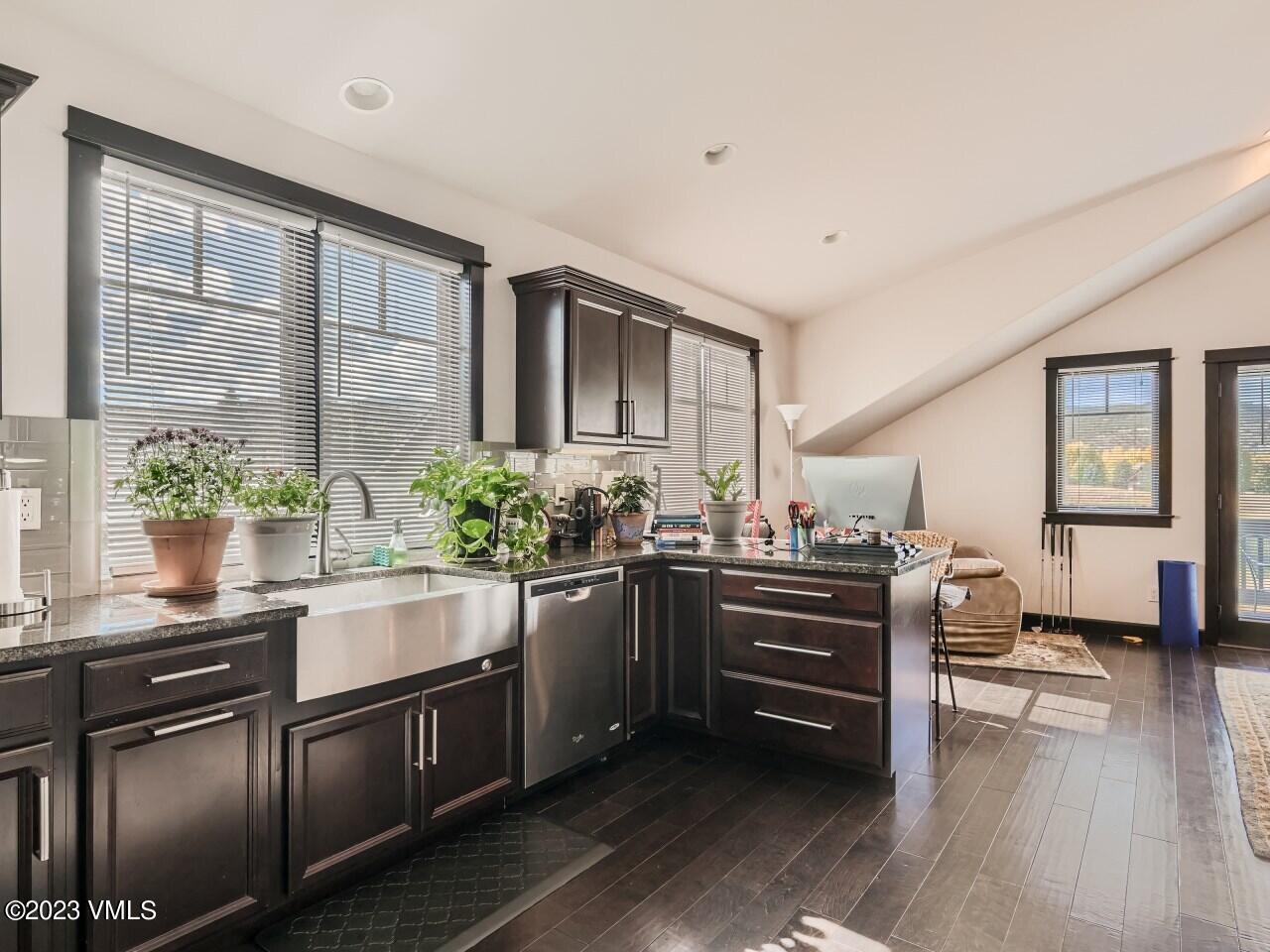 67 Robins Egg Eagle, CO 81631 - Photo 19 of 38 a kitchen with stainless steel appliances kitchen island granite countertop a stove and cabinets
