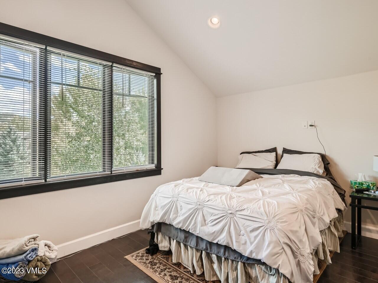 67 Robins Egg Eagle, CO 81631 - Photo 21 of 38 a bedroom with a bed and a window