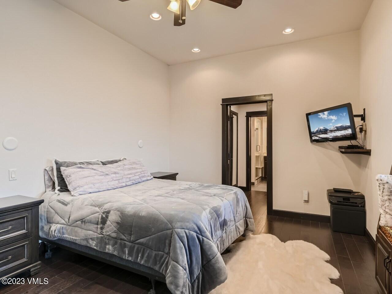 67 Robins Egg Eagle, CO 81631 - Photo 25 of 38 a bedroom with a bed and a flat screen tv