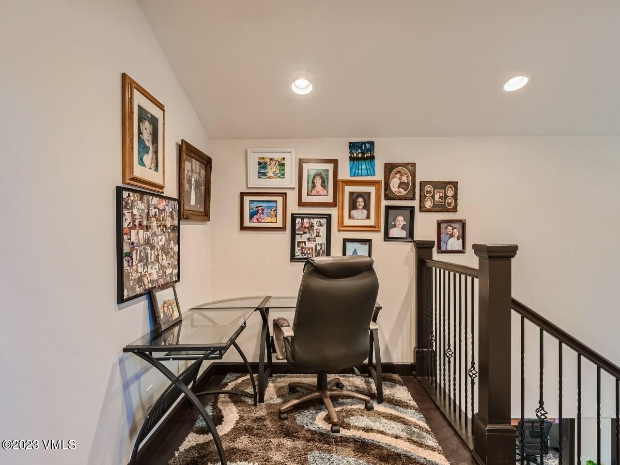 67 Robins Egg Eagle, CO 81631 - Photo 27 of 38 a work room with furniture and paintings on the wall