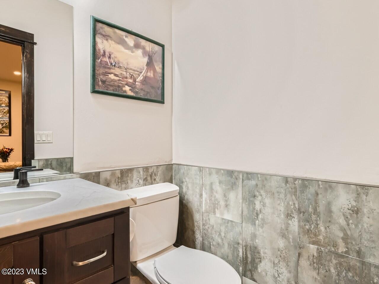 67 Robins Egg Eagle, CO 81631 - Photo 31 of 38 a bathroom with a toilet a sink and mirror