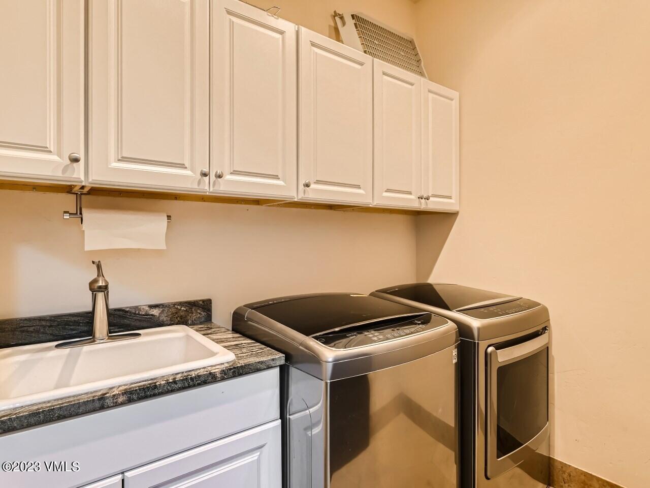 67 Robins Egg Eagle, CO 81631 - Photo 33 of 38 a kitchen with granite countertop white cabinets and sink