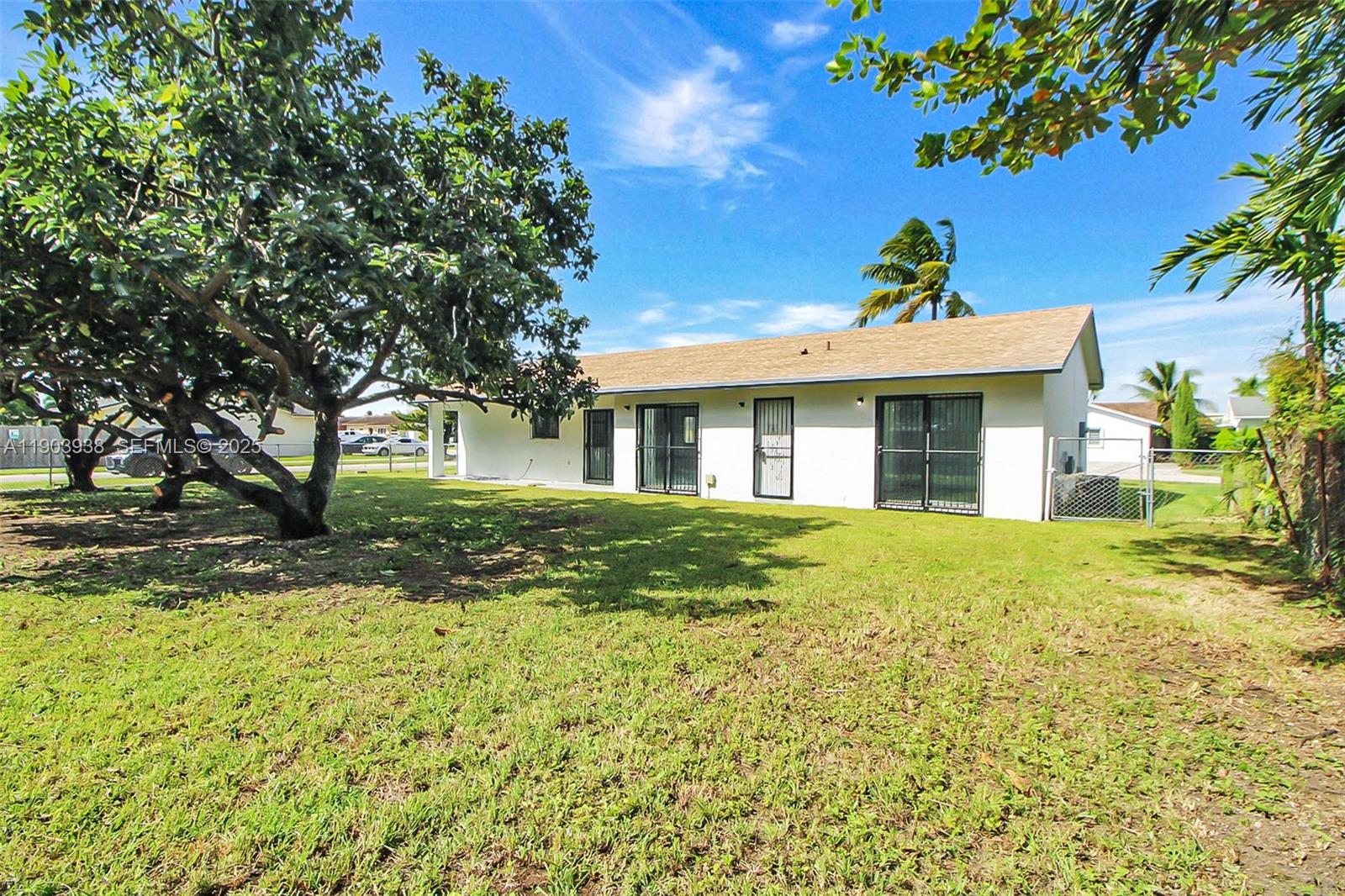 13224 Southwest 253rd Terrace Homestead, FL 33032 - Photo 15 of 19 a view of a house with a tree in the background