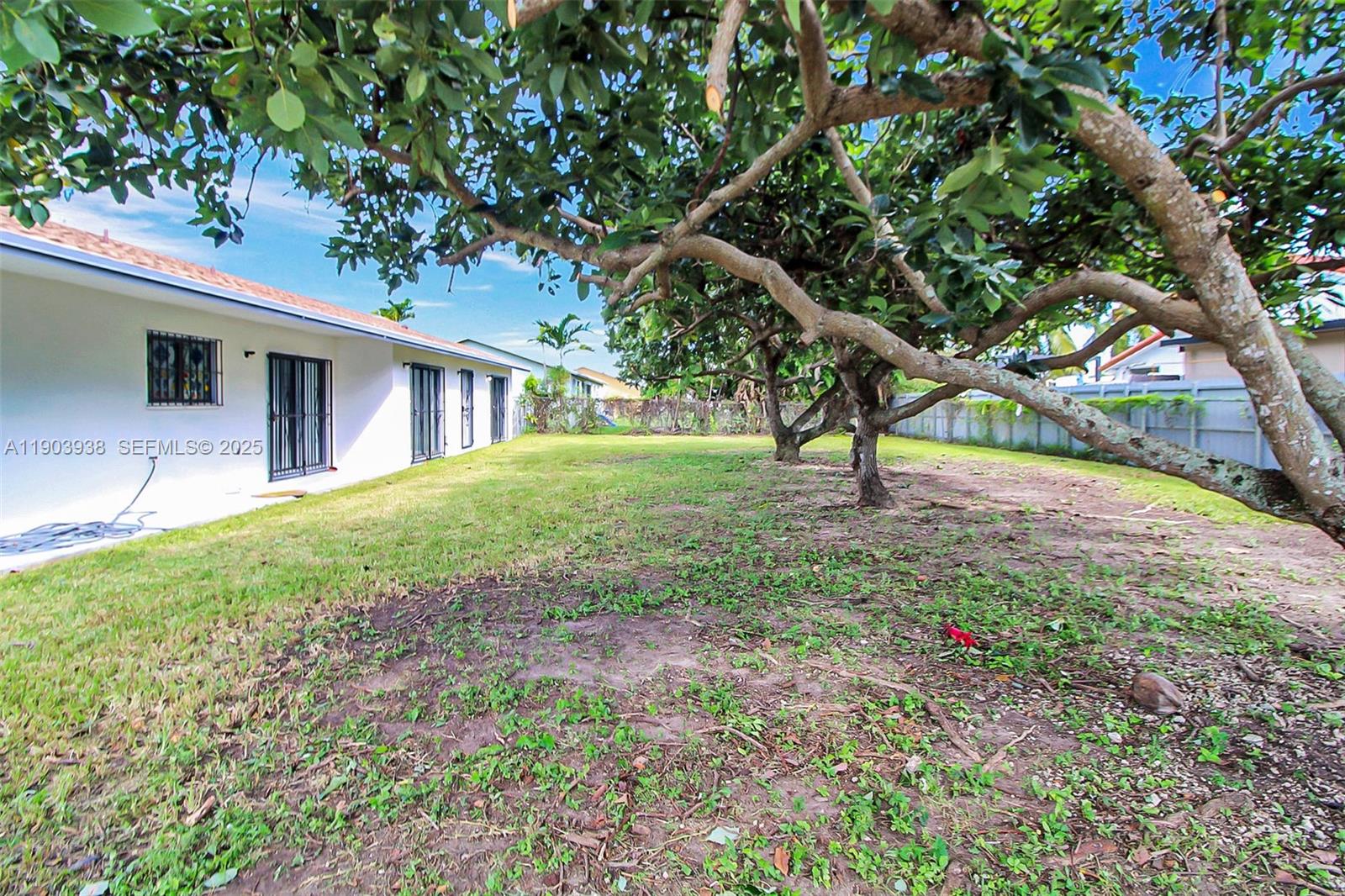 13224 Southwest 253rd Terrace Homestead, FL 33032 - Photo 18 of 19 a view of a house with a tree in a yard