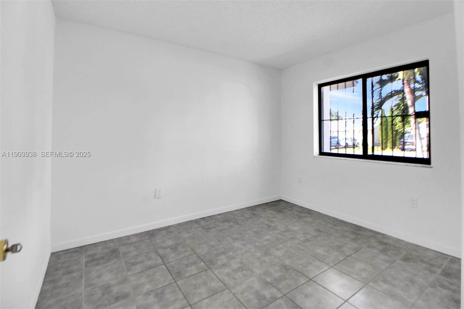 13224 Southwest 253rd Terrace Homestead, FL 33032 - Photo 4 of 19 an empty room with windows