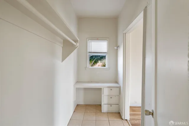 a view of cabinets and window