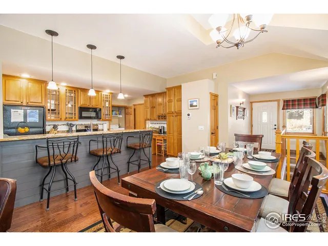 a view of a dining room furniture and chandelier
