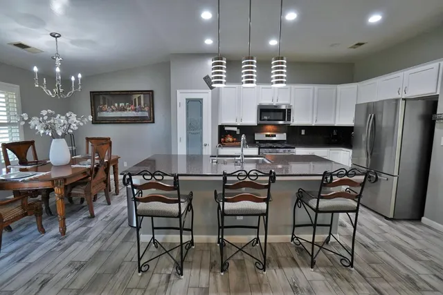 a view of a kitchen and dining room