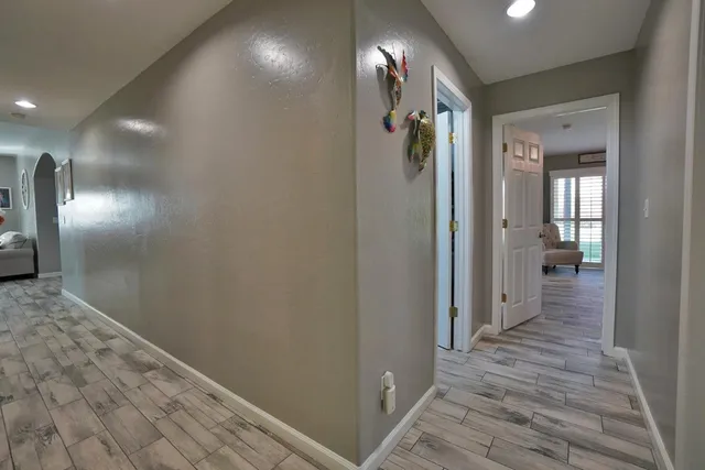 a dining room with furniture and wooden floor