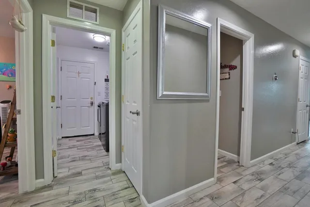 a bathroom with a double vanity sink mirror and shower