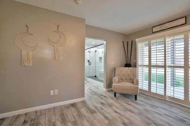 a view of a porch with furniture and garden