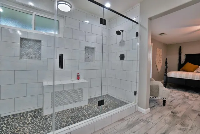 front view of a house with a yard and potted plants