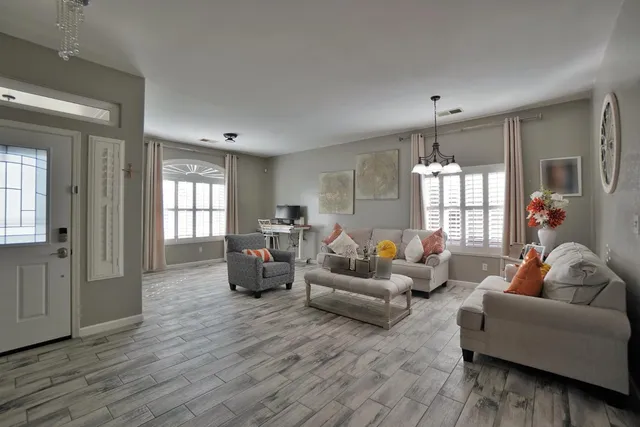 a living room with furniture and a large window