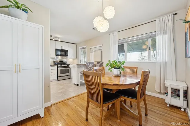 a view of a dining room with furniture window and wooden floor