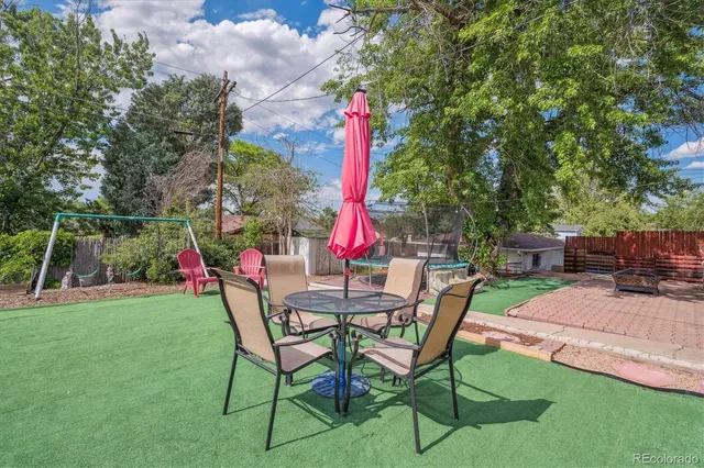 a view of a house with garden and a slide