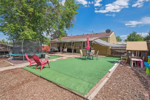 a view of a chairs in a backyard