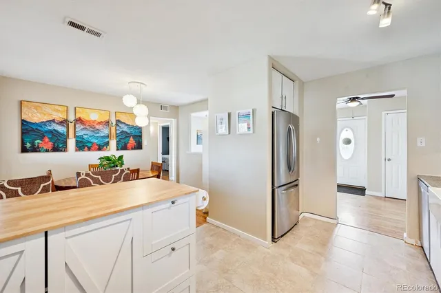 a kitchen with stainless steel appliances a stove sink microwave and cabinets