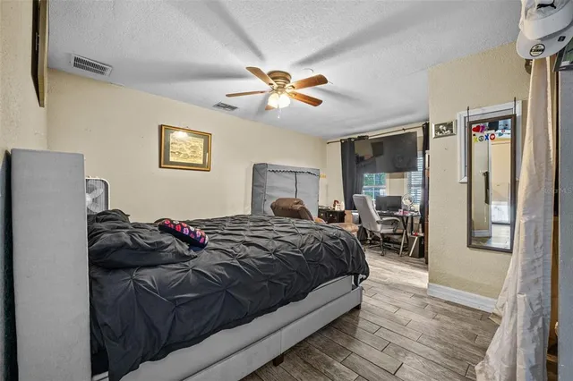 a bedroom with a bed and window