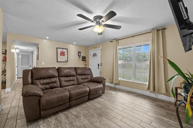 a living room with furniture and a large window