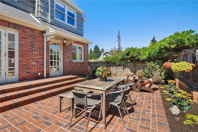 a view of a patio with couches chairs and a potted plants
