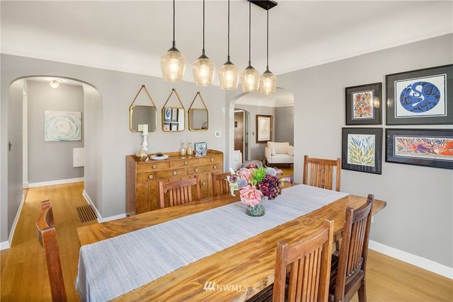 a view of a dining room with furniture and wooden floor