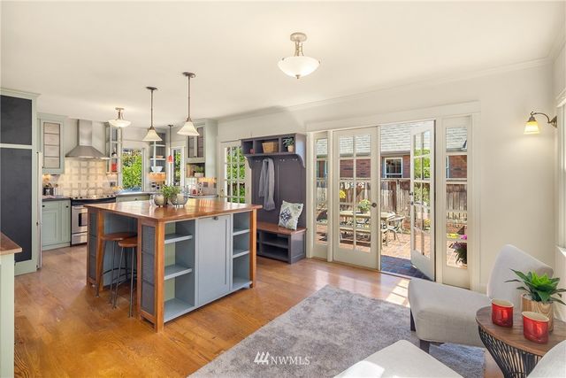 a kitchen with stainless steel appliances kitchen island granite countertop a refrigerator and stove