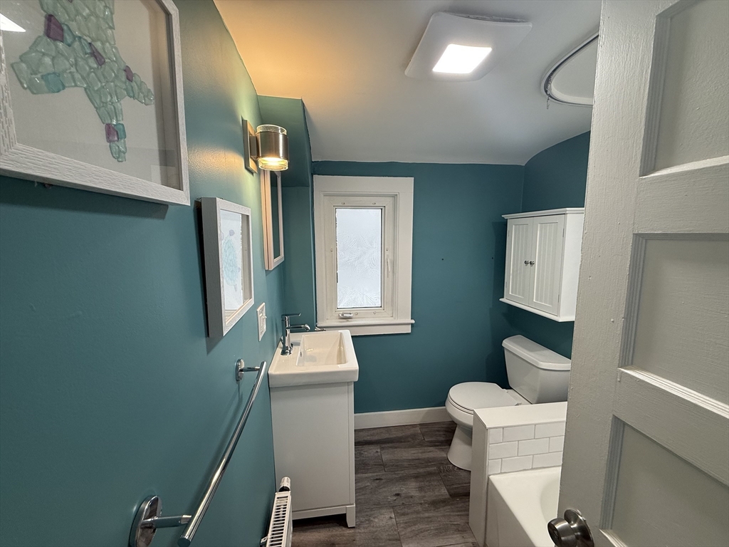 794 Sandwich Road Falmouth, MA 02536 - Photo 11 of 17 a bathroom with a toilet a sink and mirror