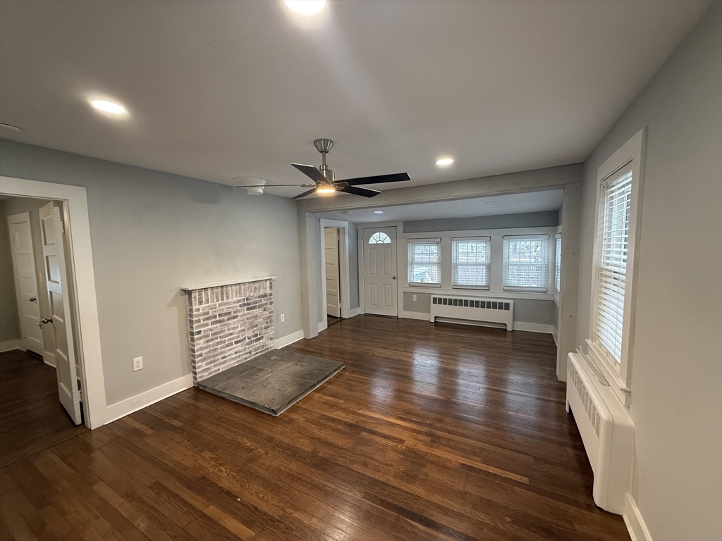 794 Sandwich Road Falmouth, MA 02536 - Photo 12 of 17 a view of empty room with wooden floor and fan