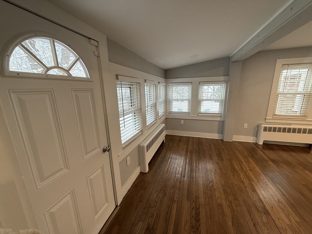 794 Sandwich Road Falmouth, MA 02536 - Photo 13 of 17 wooden floor in an empty room with a window