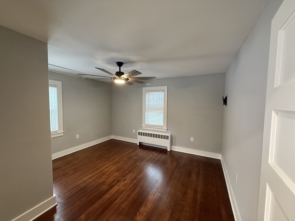 794 Sandwich Road Falmouth, MA 02536 - Photo 15 of 17 a view of empty room with wooden floor and fan