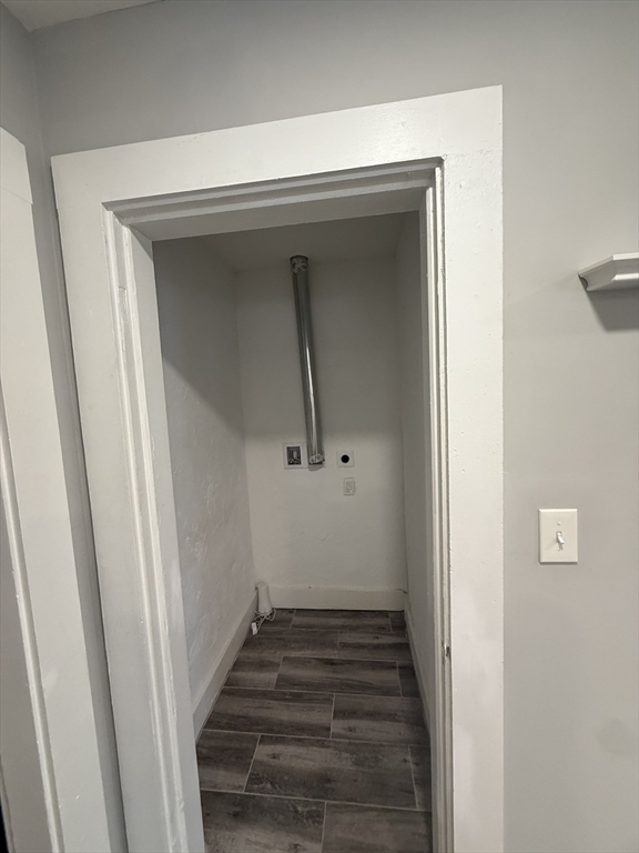794 Sandwich Road Falmouth, MA 02536 - Photo 7 of 17 a view of a hallway with wooden floor and staircase