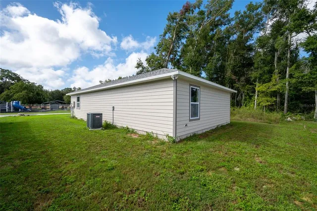 a backyard of a house with lots of green space