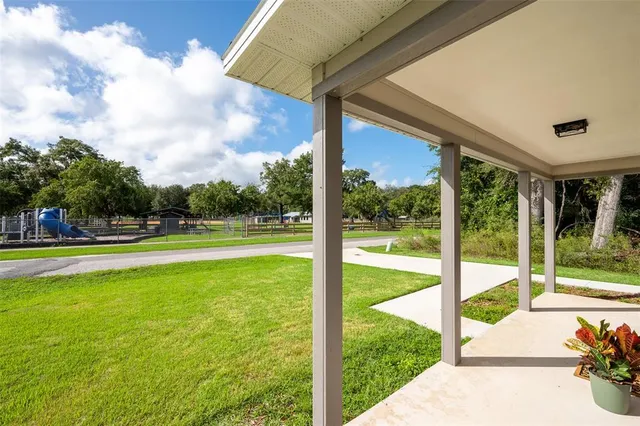 a view of a swimming pool with a porch