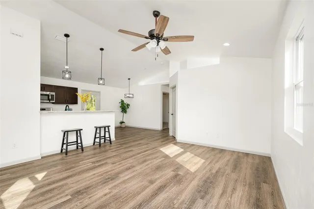 a view of kitchen and dining room with wooden floor