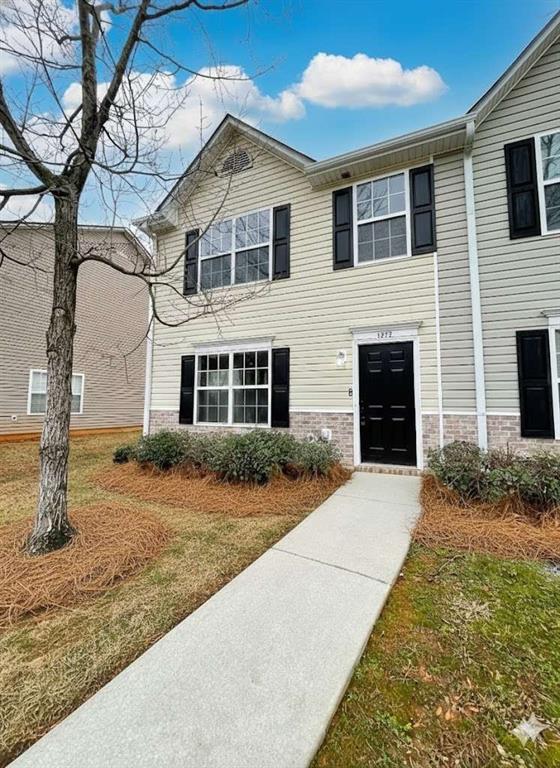 1771 Fielding Way Hampton, GA 30228 - Photo 1 of 1 a front view of a house with garden