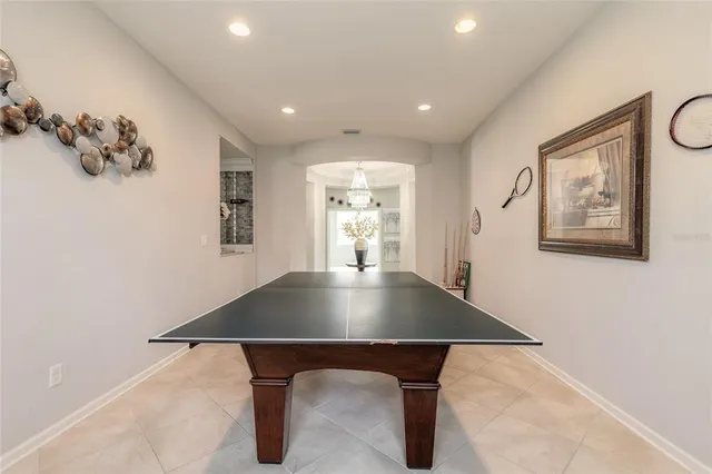a hallway with wooden floor and a fireplace