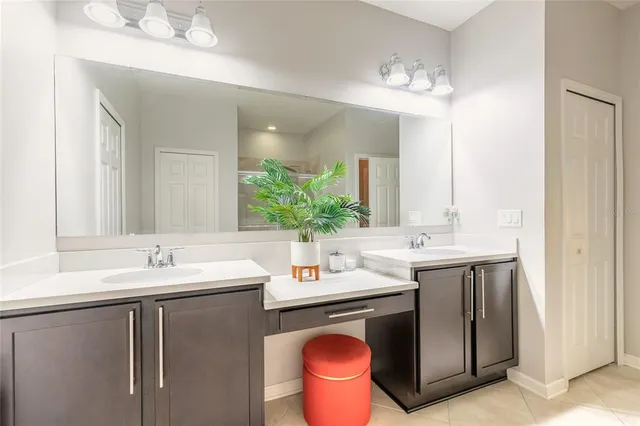 a living room with furniture and large windows