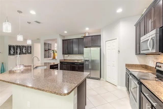 a kitchen with cabinets and window