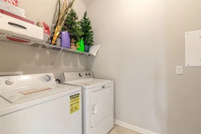 a aerial view of a house with a yard and lake view
