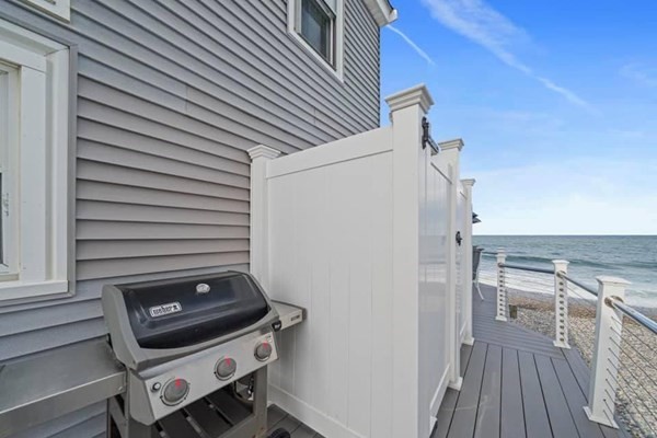 272 Central Avenue Scituate, MA 02050 - Photo 9 of 9 a view of a patio with wooden floor and a fireplace