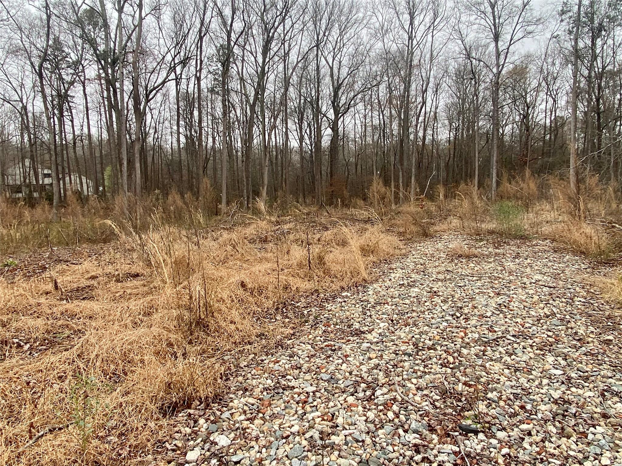 a view of outdoor space with wooden fence