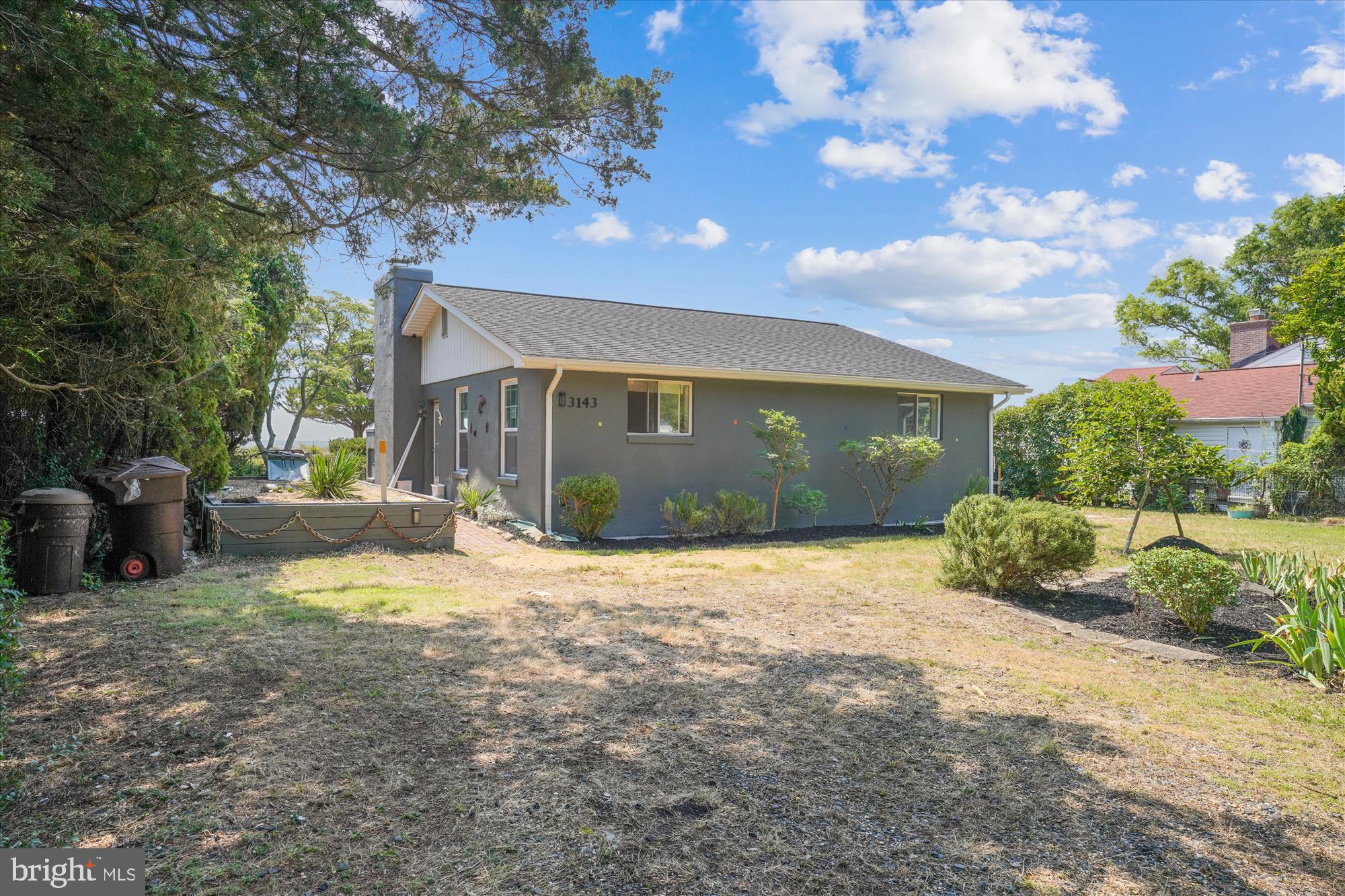 3143 Calvert Boulevard Lusby, MD 20657 - Photo 16 of 36 a view of a house with backyard and a tree