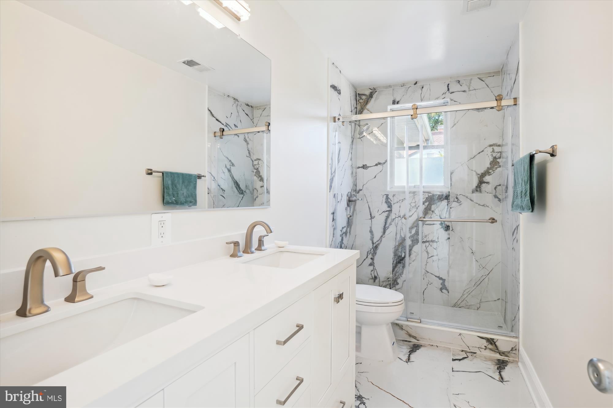 3143 Calvert Boulevard Lusby, MD 20657 - Photo 28 of 36 a bathroom with a sink toilet and shower