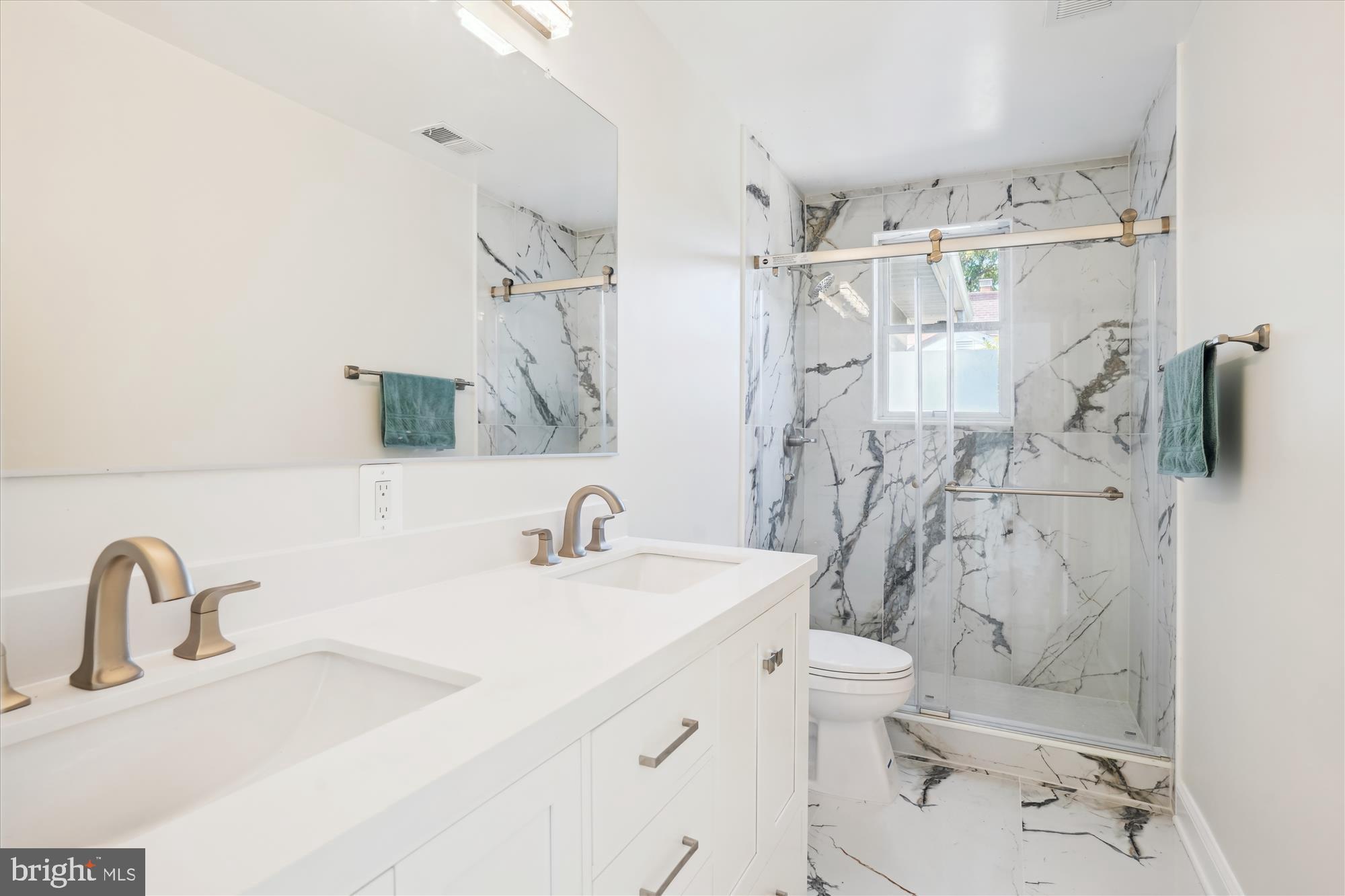 3143 Calvert Boulevard Lusby, MD 20657 - Photo 29 of 36 a bathroom with a sink toilet and shower