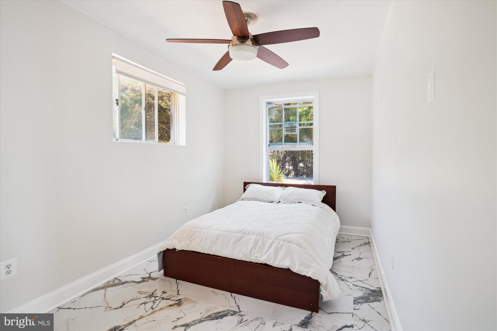 3143 Calvert Boulevard Lusby, MD 20657 - Photo 30 of 36 a bedroom with a bed and a window